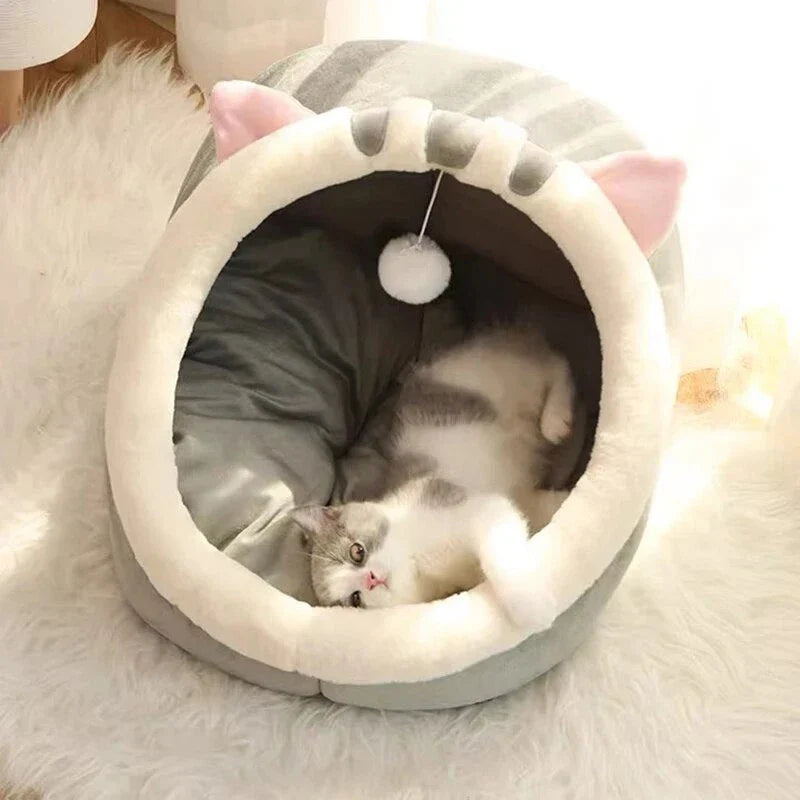 Cozy cat bed with plush cushion in various colors, providing a warm and comfortable winter retreat for cats and small dogs.