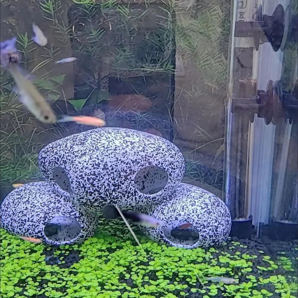 Realistic and natural-looking fish tank decor made of premium resin material, designed to provide a safe haven for fish and shrimp breeding and hiding