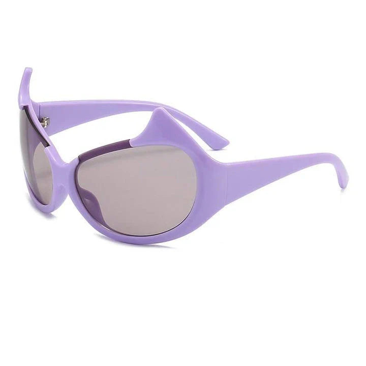Stylish cat-eye sunglasses with oversized frames, semi-rimless design, and punk-inspired detailing for a timeless, glamorous look