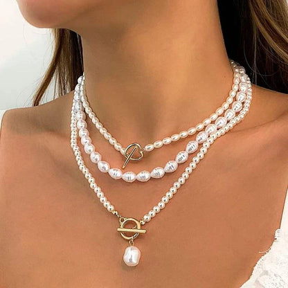 Elegant imitation pearl heart pendant necklace with lustrous bead chain and secure closure