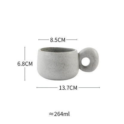 Handcrafted Japanese stoneware retro coffee mug in apricot and grey colors with a comfortable grip and minimalist design