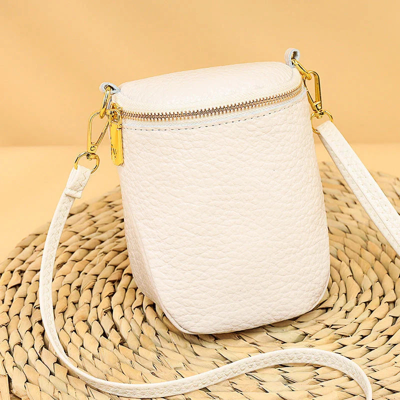 Premium leather crossbody bag with adjustable strap, multiple pockets, and sleek Korean-inspired style