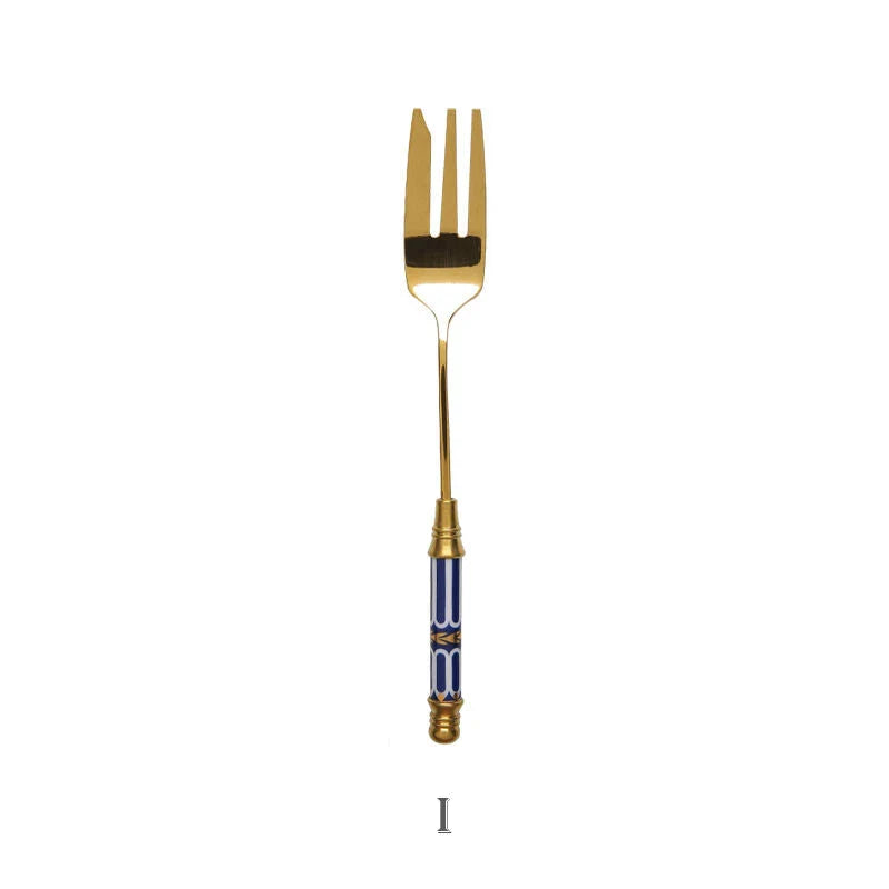 Elegant gold-plated dessert fork with intricate ceramic handle design