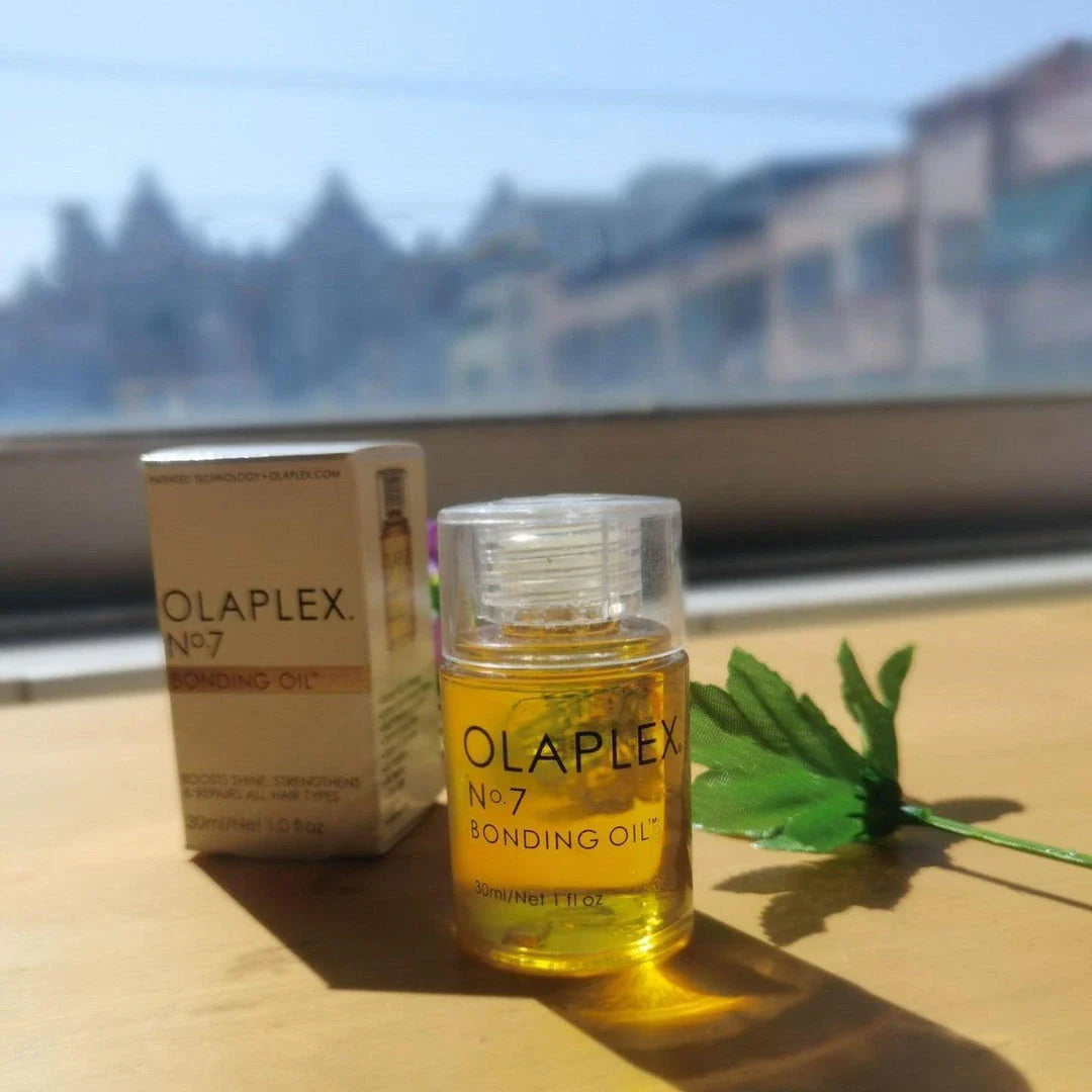 Bottle of Hair Smoothing and Anti-Heat Repair Oil for nourishing and protecting damaged hair