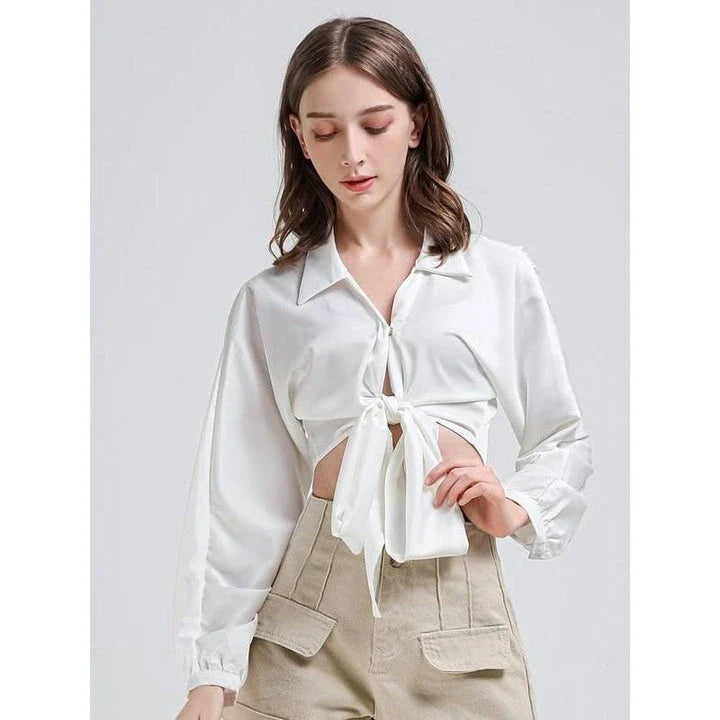 Elegant white vintage-inspired crop blouse with v-neck and long sleeves, a timeless and versatile wardrobe essential