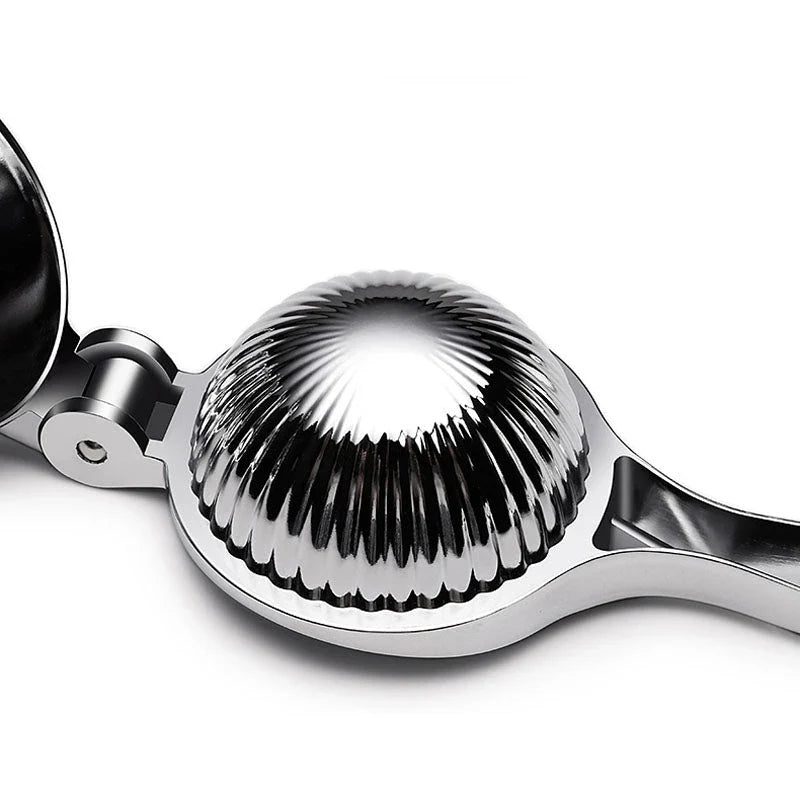 Manual citrus juicer made of stainless steel with an ergonomic handle for easy and efficient juice extraction