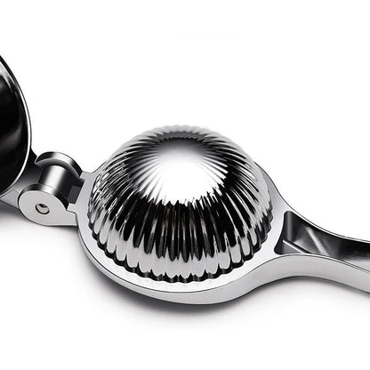 Manual citrus juicer made of stainless steel with an ergonomic handle for easy and efficient juice extraction