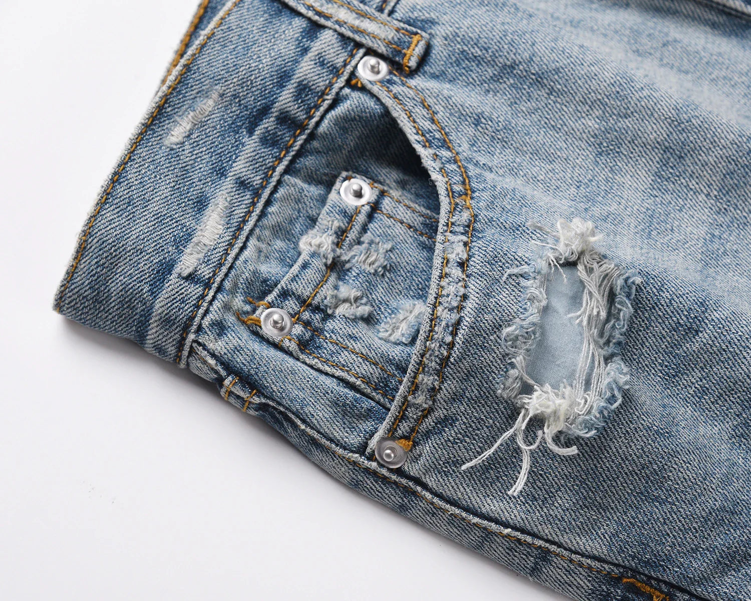 Premium distressed denim jeans with ripped detailing, perfect for casual streetwear style