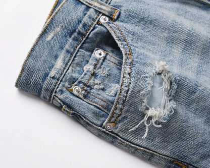Premium distressed denim jeans with ripped detailing, perfect for casual streetwear style