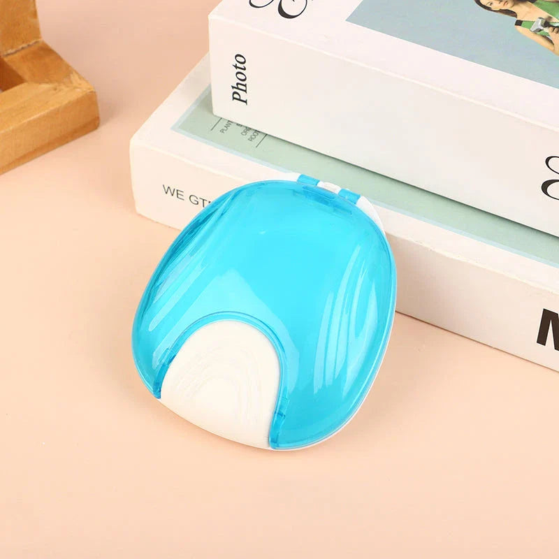 Compact, transparent dental retainer storage box with a push-to-open mechanism for easy access to dental appliances