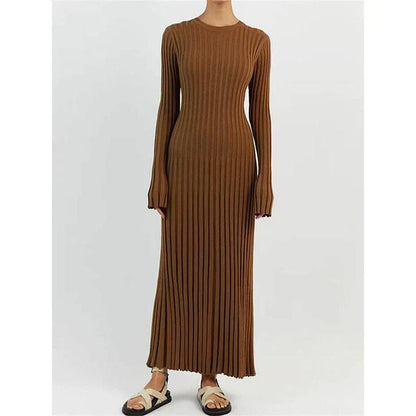 Timeless elegant pleated knit dress in black, perfect for summer office wear with a sophisticated and comfortable design.