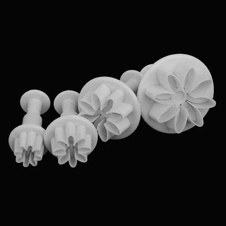 A set of 33 decorative pastry cutters in various shapes and sizes, made from durable, food-grade plastic for precise, clean cuts on cookies, pies, and other baked goods.