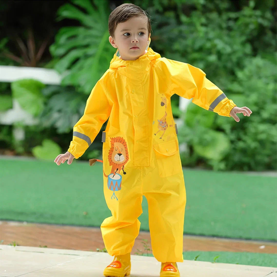 Children in a colorful dinosaur-themed waterproof rain jumpsuit playing outdoors in the rain