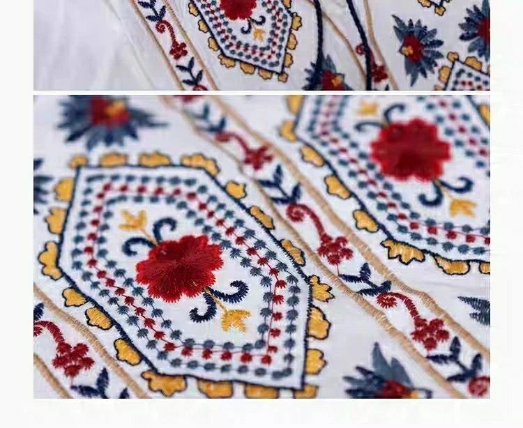 Elegant embroidered cotton-linen dress with tassels, featuring a waist-cinching A-line silhouette in vibrant colors