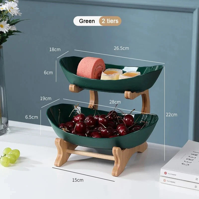 Three-tier plastic and bamboo fruit display tray with unique leaf-shaped design, available in white, beige, and green colors