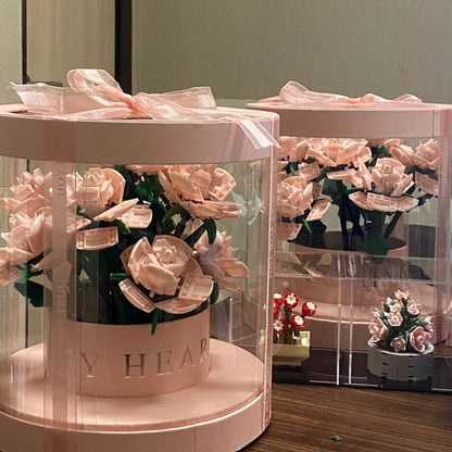 A decorative flower pot featuring a stunning rose bouquet design, made of high-quality plastic for indoor or outdoor use.