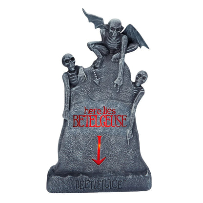 Glowing ghost skull tombstone decor with a spooky, otherworldly glow for Halloween