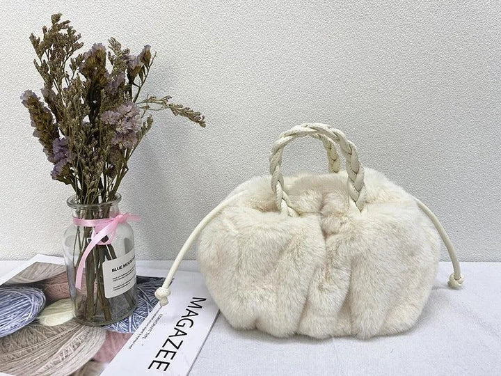Elegant pleated leather and mink fur handbag in various colors, featuring a chic and modern cloud-like design