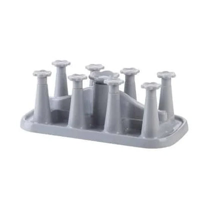 Flower-shaped mug holder rack in white, with 8 slots for organizing and displaying mugs on a kitchen countertop
