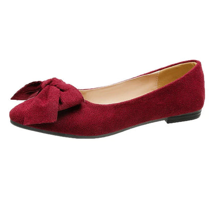 Fashionable flat shoes with bow accent, pointed toe, and low heel for comfortable, slip-on wear