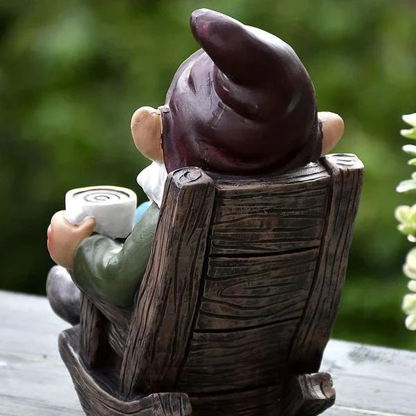 Charming outdoor garden gnome decoration made of durable resin, featuring a relaxing gnome on a rocking chair