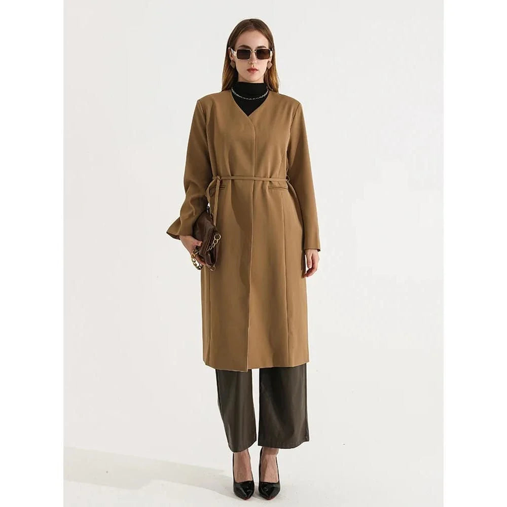 Women's full-length trench coat with lace-up waist, turn-down collar, and elegant full sleeves