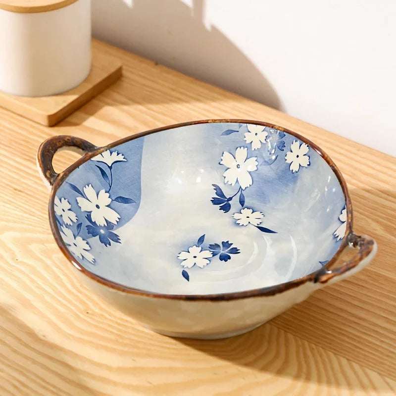 Elegant porcelain noodle and soup bowl with a comfortable handle, perfect for serving a variety of hot and cold dishes.