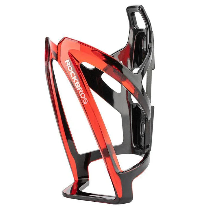 A stylish, lightweight cycling bottle holder with a two-tone design, securely holding a water bottle on a bike.