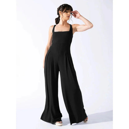 Chic sleeveless jumpsuit with wide-leg pants, made with Rayon and Spandex for comfort and breathability.