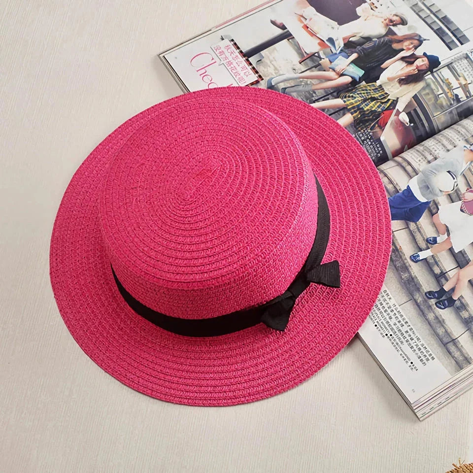 Classic straw Panama hat with a bow detail, offering sun protection and fashionable summer style
