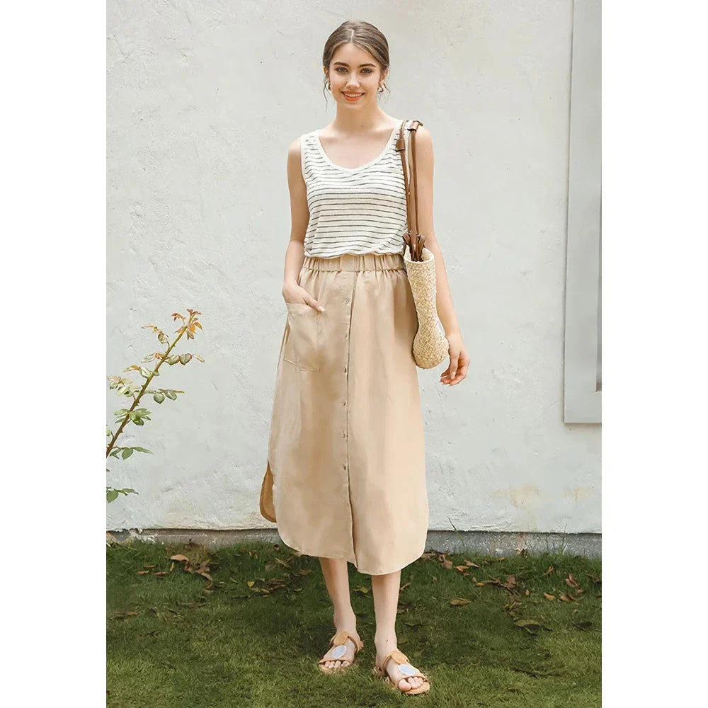 Elegant cotton linen maxi skirt with high waist, button-up front, and side split for a flowing, comfortable look