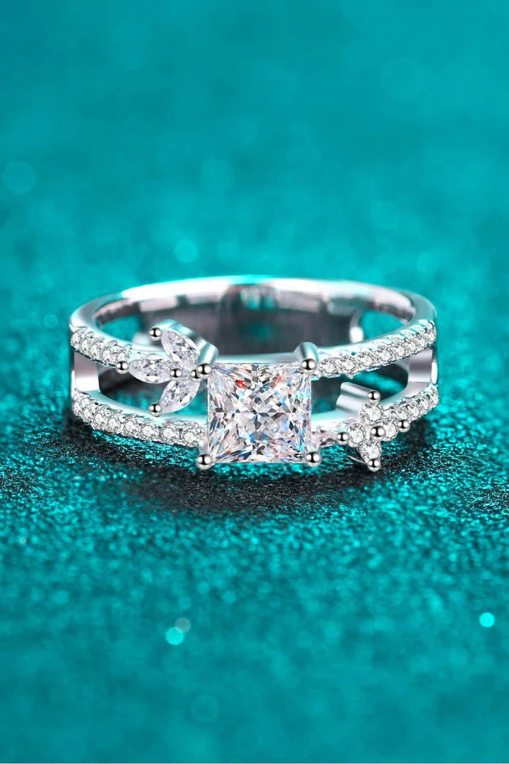 A close-up view of the Moissanite Double Layered Ring, showcasing its elegant two-tone design with a sparkling moissanite center stone and rhodium-plated sterling silver band.