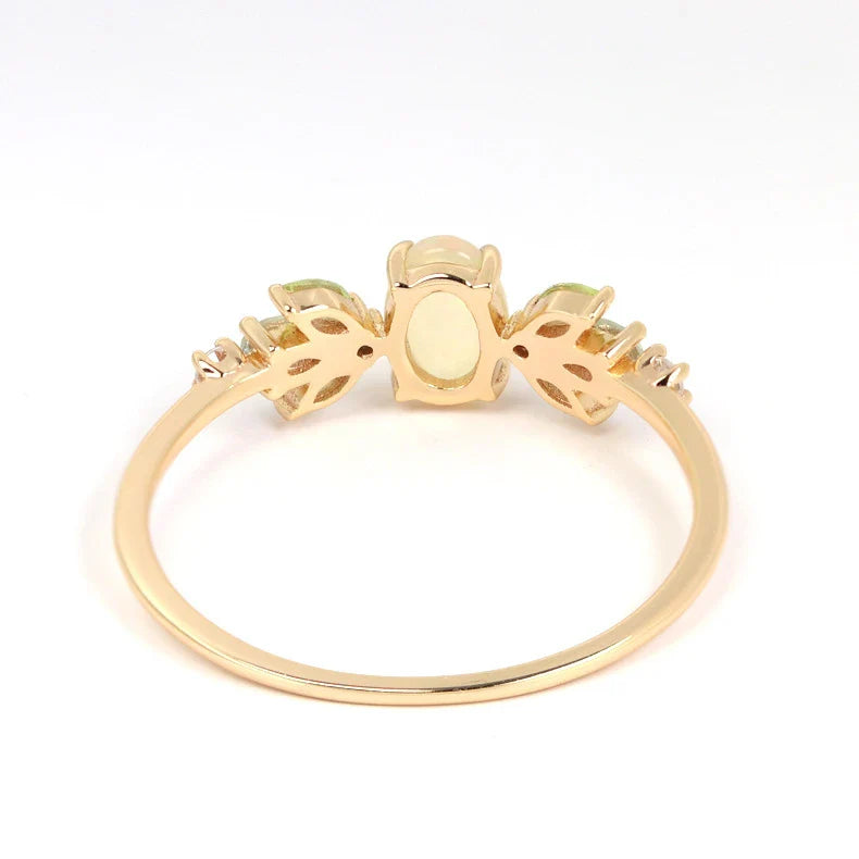 Sterling silver ring featuring a natural opal gemstone in a modern geometric design