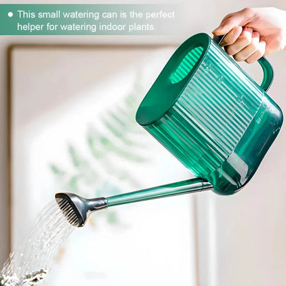 A large, dark grey gardening watering can with a long spout and sprinkler head for efficient, hassle-free plant watering