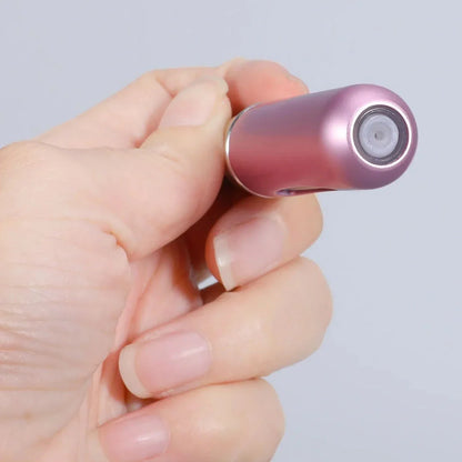 Compact and stylish portable perfume atomizer in various matte colors, including gold, black, and green