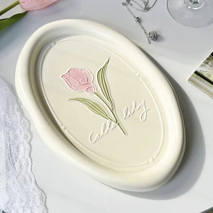 Elegant ceramic plate featuring a delicate floral relief design of Calla Lily and Tulip flowers, perfect for refined dining