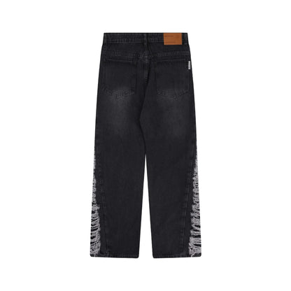 Premium loose fit distressed denim trousers for men and women, featuring a relaxed silhouette, high-quality cotton construction, and trendy distressed details.