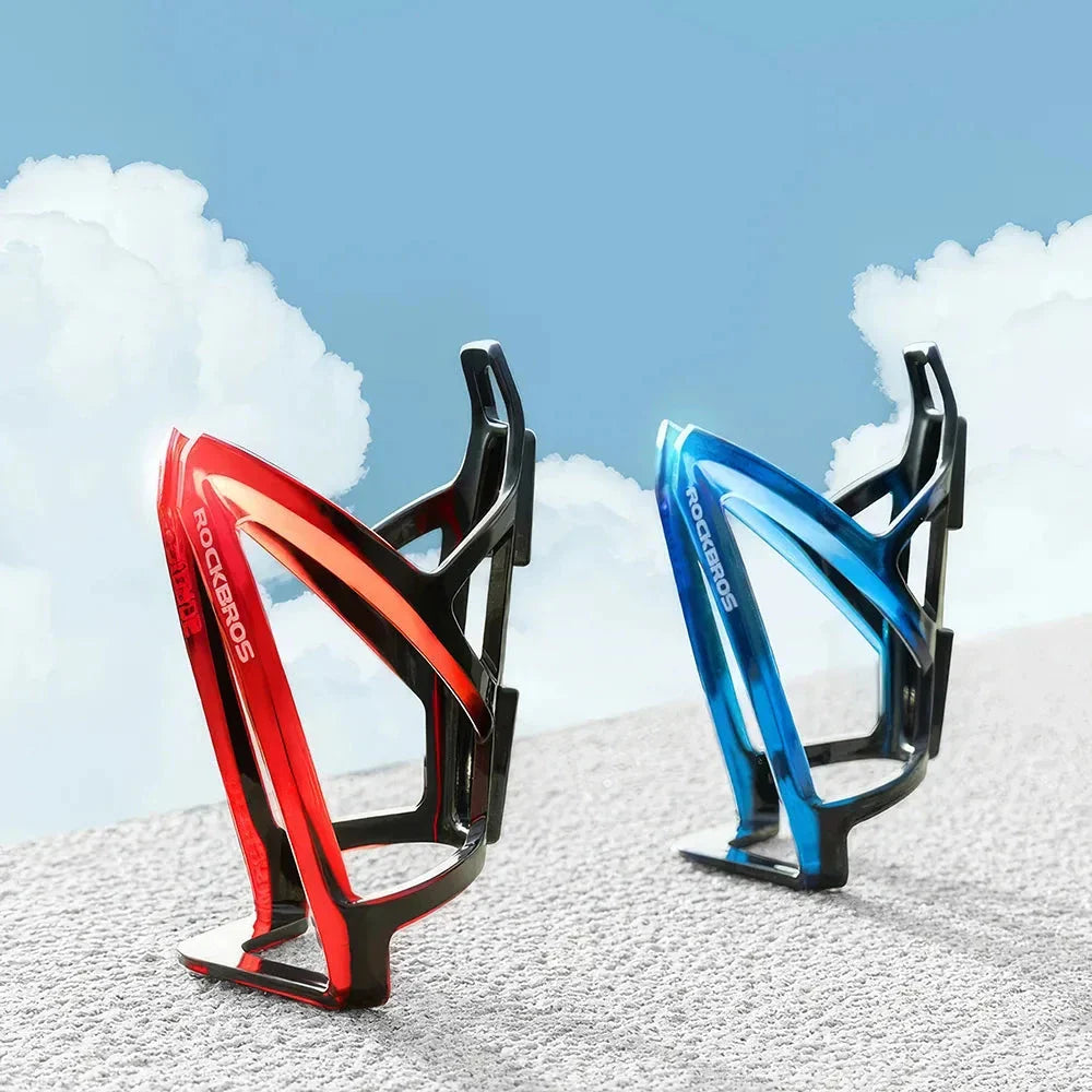 A stylish, lightweight cycling bottle holder with a two-tone design, securely holding a water bottle on a bike.