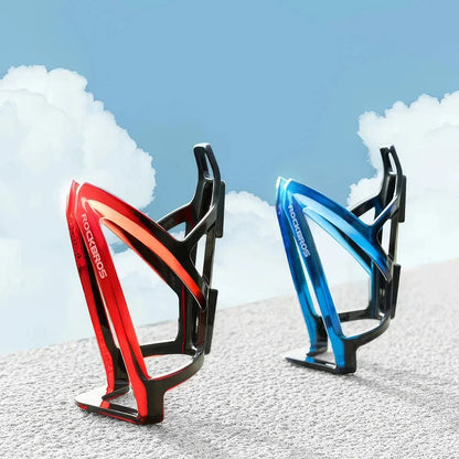 A stylish, lightweight cycling bottle holder with a two-tone design, securely holding a water bottle on a bike.