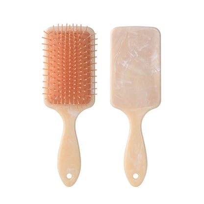 Marble Air Cushion Scalp Massage Hairbrush with air cushion technology for a soothing scalp massage and smooth, frizz-free hair