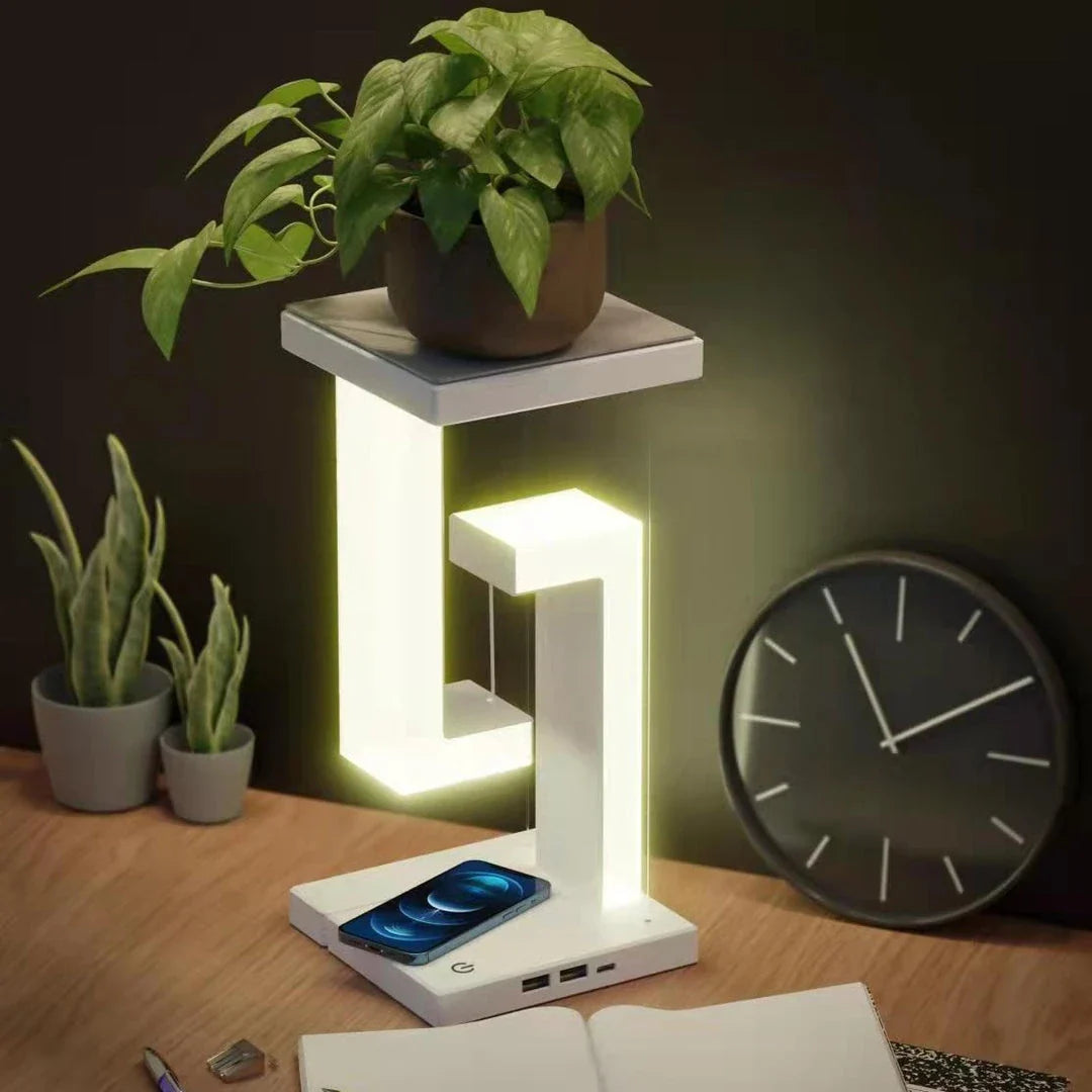 A modern, levitating desk lamp with wireless charging capabilities for smartphones