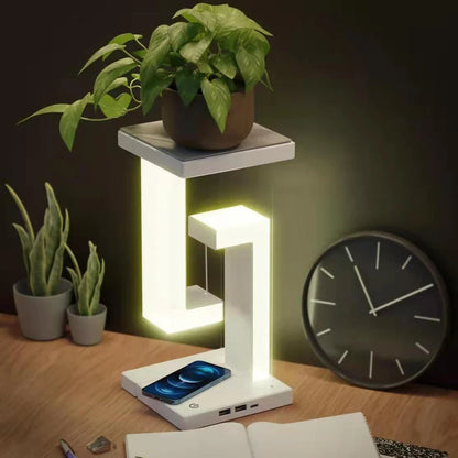 A modern, levitating desk lamp with wireless charging capabilities for smartphones