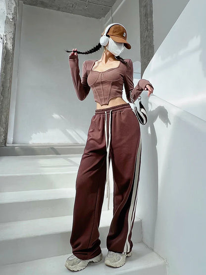 A stylish slim-fit short autumn top with an open waist design, made of premium polyester fabric with long sleeves and a square collar.