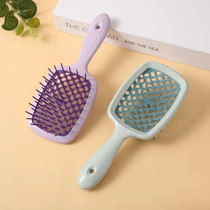 DetanglePro Air Cushion Hair Comb in purple, pink, and green colors for effortless hair detangling