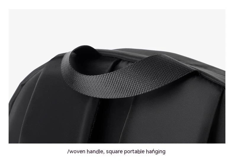 A large, simple, and stylish backpack made of durable nylon material with multiple compartments for organized storage and comfortable shoulder straps for easy carry.