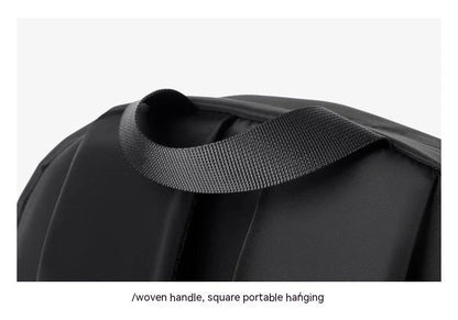 A large, simple, and stylish backpack made of durable nylon material with multiple compartments for organized storage and comfortable shoulder straps for easy carry.