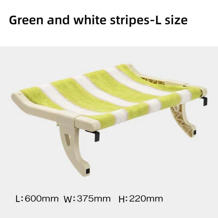 Cat relaxing in a cozy, hanging hammock bed placed in a sunny window