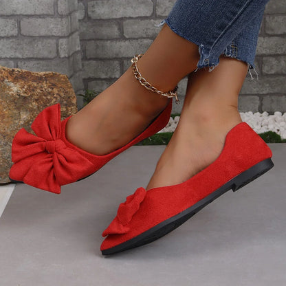 Fashionable flat shoes with bow accent, pointed toe, and low heel for comfortable, slip-on wear
