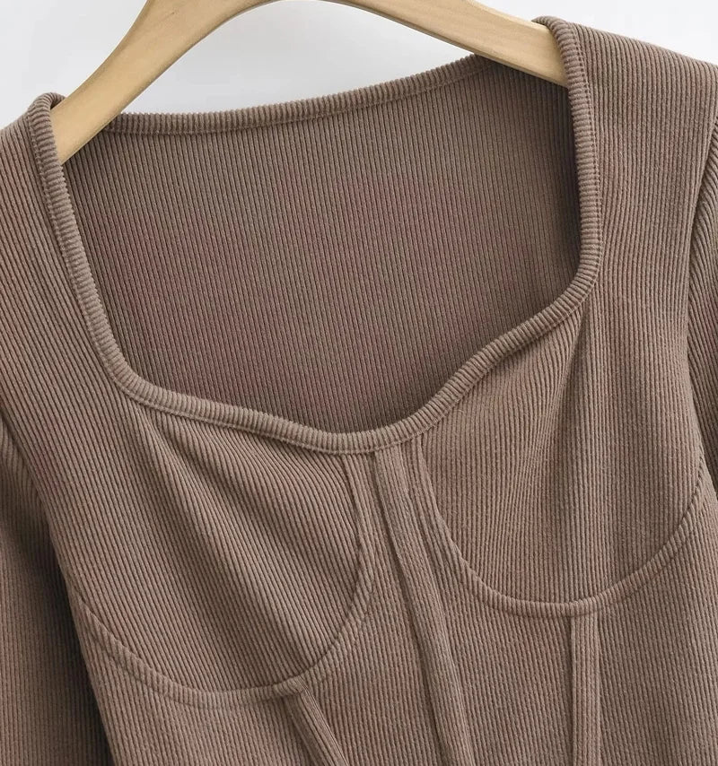 A stylish slim-fit short autumn top with an open waist design, made of premium polyester fabric with long sleeves and a square collar.