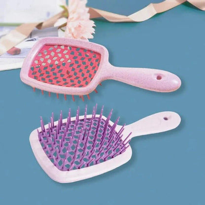 DetanglePro Air Cushion Hair Comb in purple, pink, and green colors for effortless hair detangling